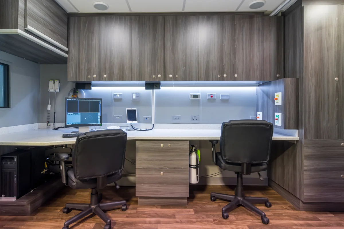 Technologist workstations inside an SMS mobile imaging trailer.