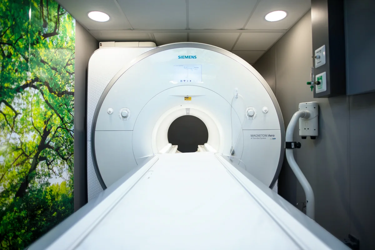 Wide bore MRI scanner and patient table inside an SMS mobile imaging unit.